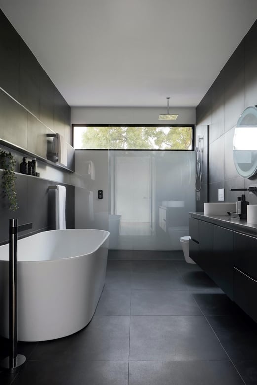 A bathroom with a tub and sink
Description automatically generated with medium confidence