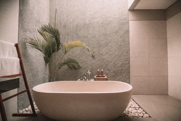 A picture containing toilet, bathroom, plant, stone
Description automatically generated
